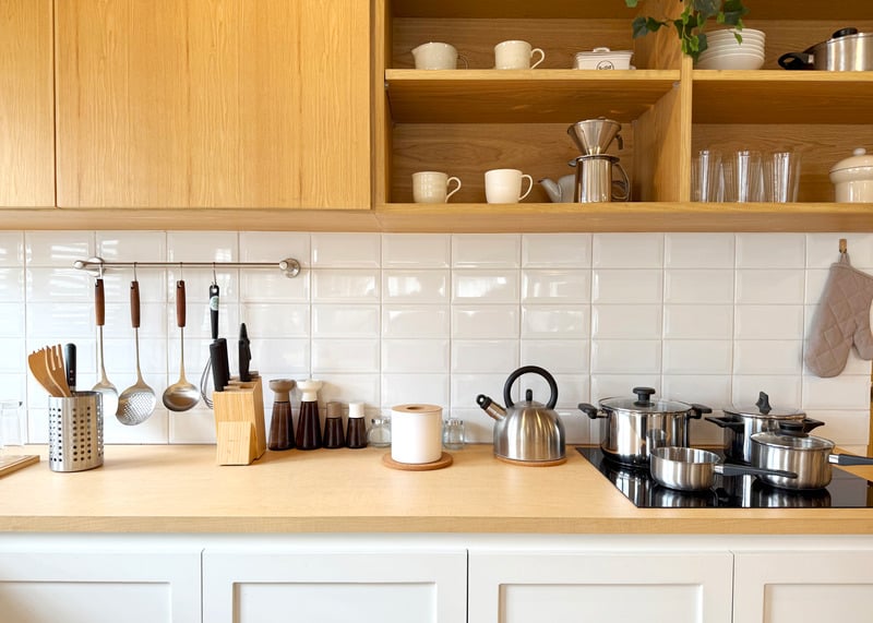 Bright premium kitchen cookware and home goods displayed on shelves